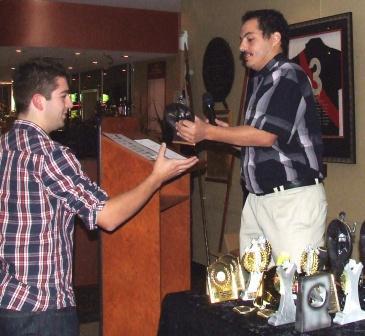 *Sixths skipper Danny Terzini (right) hands the fielding award to Stephen Tassos.